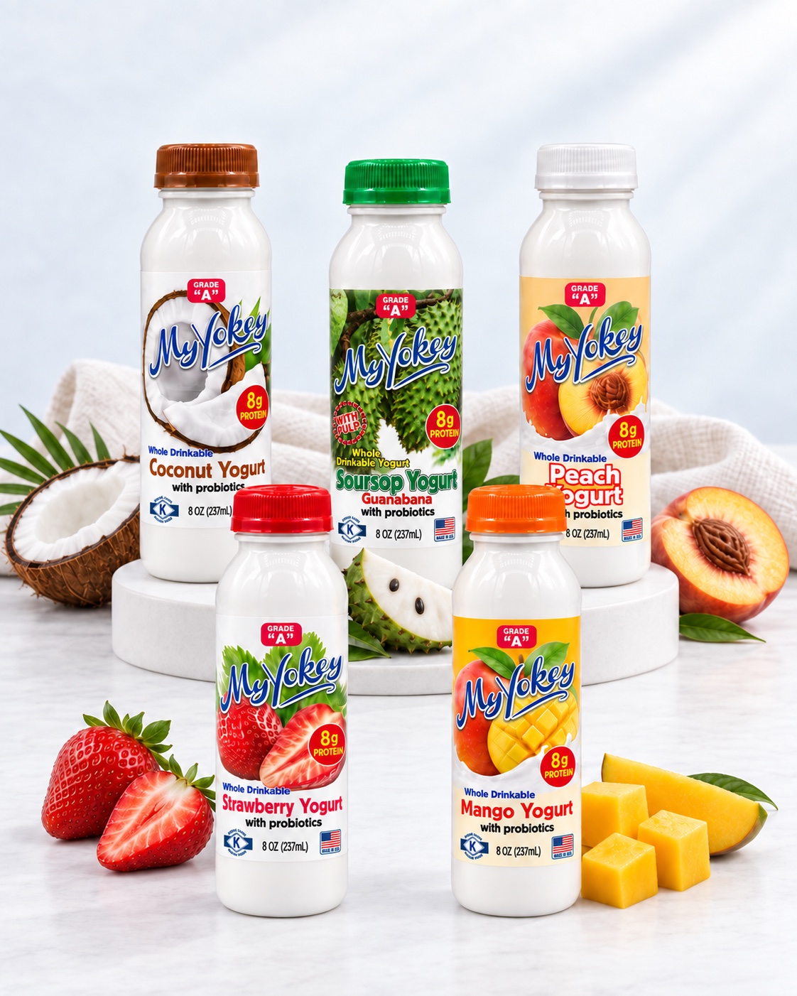 Five 8-ounce MyYokey bottles in coconut, soursop, peach, strawberry, and mango flavors